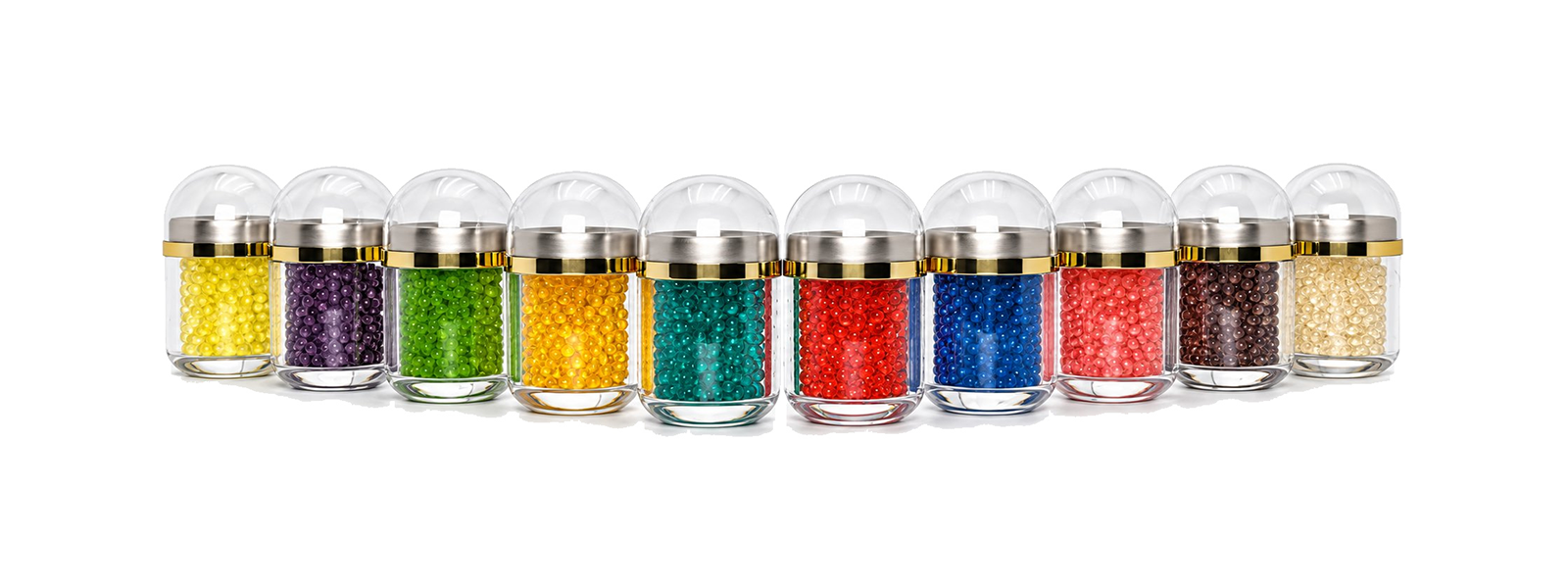 A lineup of colorful capsule samples in clear display jars